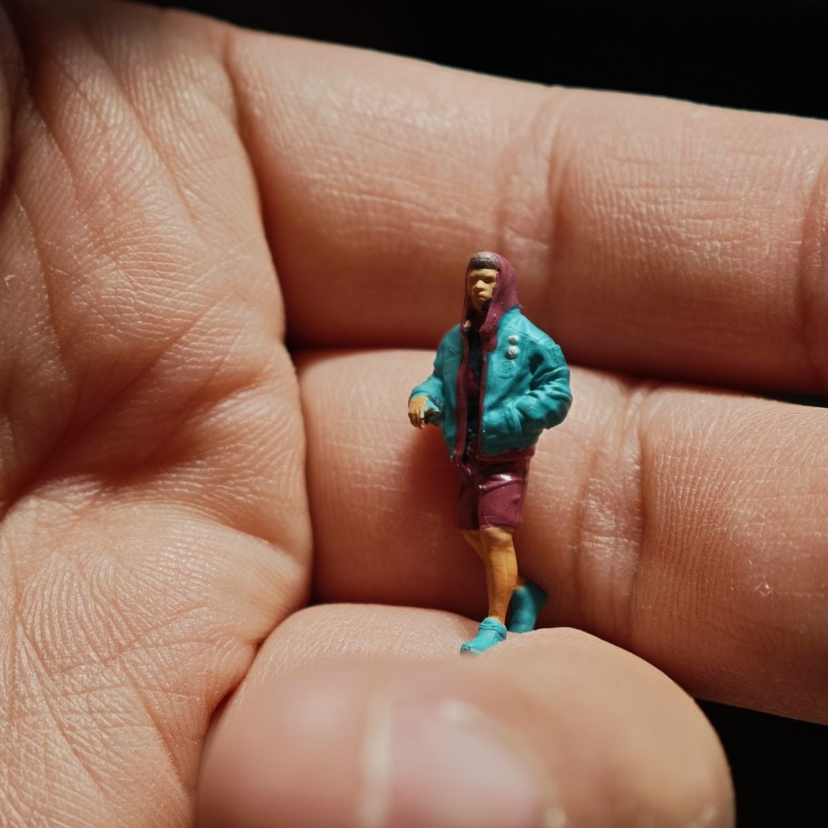 1:64 Male in green puffy jacket
